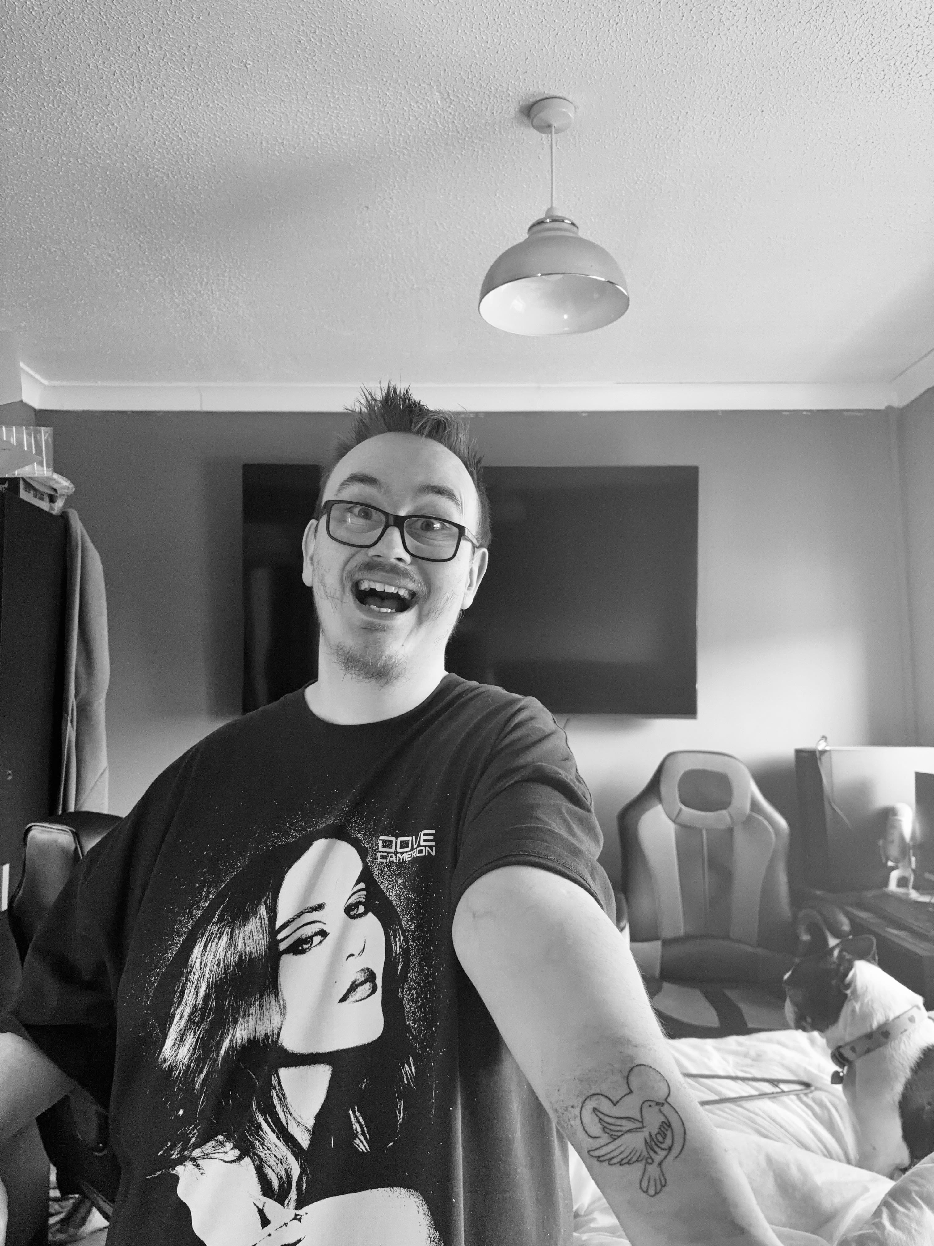 DovelyTom showing tattoo - black and white